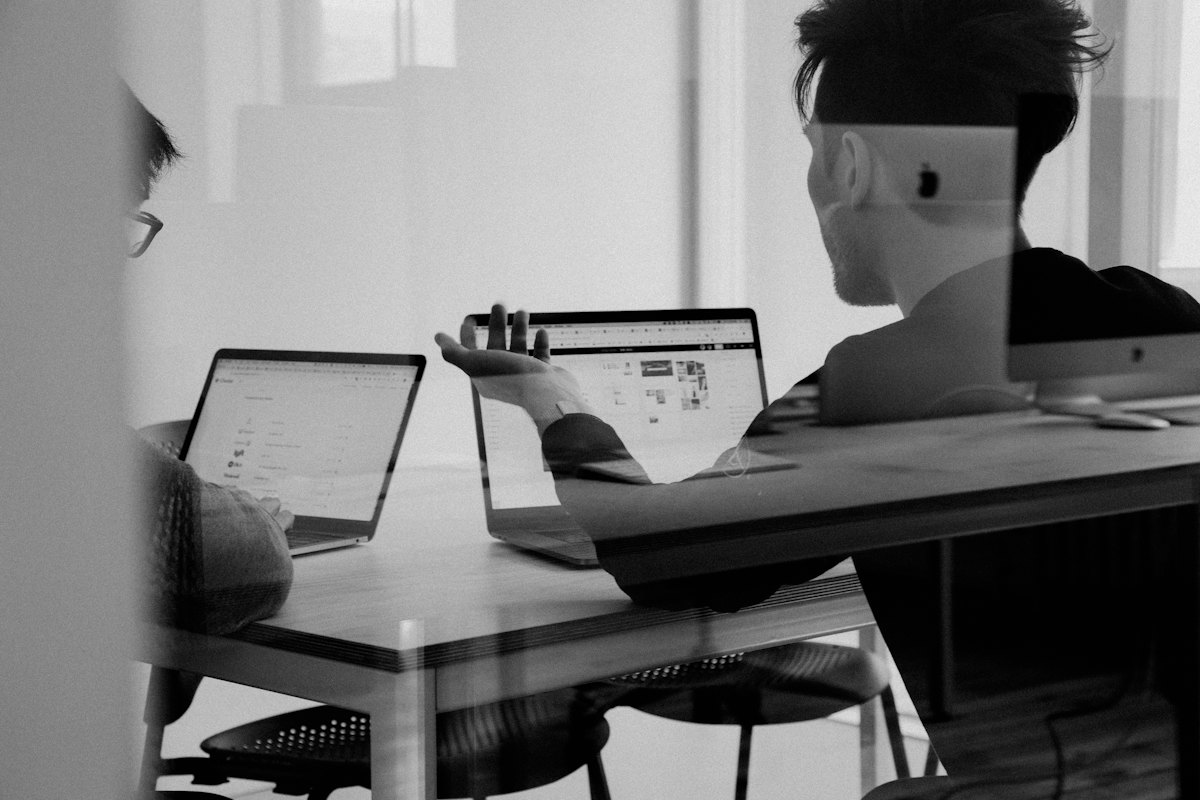 Analyst reviewing data on a laptop